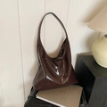 Deep brown glossy patent leather hobo bag with a modern minimalist shoulder strap - Coffee