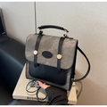 Detailansicht der Vintage-Handtasche aus grauem Denim und schwarzem Leder mit Schnallen - Grau und Schwarz Patchwork (Schwarz)