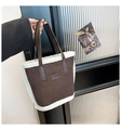 Detail of dark brown faux suede tote bag featuring white faux shearling trim and fashion label - Coffee No Charm