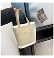 Detail showing plush faux fur trim and fashion leather patch on the beige suede tote bag - Khaki (No Pendant)