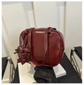 Detail of dark red retro PU leather handbag with heart charm and bow accents - Red
