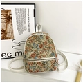 Detail of vintage floral pattern backpack with white leather trim and metal zippers - White Type 2