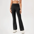 High-waisted black flare yoga pants featuring a matte finish and tummy control design - Black