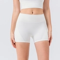 Women's white high-waisted yoga shorts with side pockets and peach butt lifting design - S / Bottoms / White