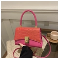 Detail of stone embossed texture on pink and orange crossbody bag with gold clasp - Pink
