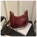 Deep wine red faux leather hobo bag with gold chain strap and smooth glossy finish - Red