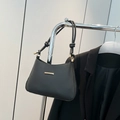 Elegant black shoulder bag with gold hardware and knotted strap for daily office wear - Black