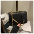 Minimalist black woven crossbody bag with gold chain strap and square flap silhouette - Black