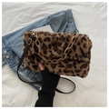 Detail of leopard print faux fur handbag with thick acrylic chain and denim background - Leopard Brown