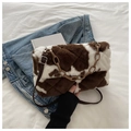 Detail of plush cow print crossbody bag with brown resin chain and adjustable leather strap - Coffee