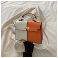 Schicke Handtasche aus Kunstleder in Orange und Weiß mit goldenem Drehverschluss und Riemen - Weiß