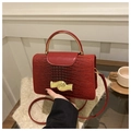Red crocodile texture crossbody bag with gold wavy lock and metallic handle - Red