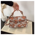 Fashionable crossbody bag in orange and grey snakeskin pattern with a knotted handle - Orange