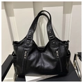 Detailed view of black tote bag with lychee grain texture and dual front zippers - Black