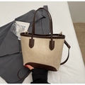 Close-up of retro contrast bucket bag with brown leather trim and detachable shoulder strap - Off White
