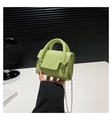 Detail of light green crocodile pattern mini handbag with silver chain and dual handles - Green