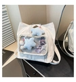 Detail of the white nylon ita bag with a clear PVC window and plush star charms - White With Pendant