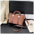 Brown vintage trapezoid handbag with dark leather handles and a detachable crossbody strap - Brown