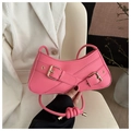 Detail of bright pink PU leather shoulder bag with gold metal buckles and knotted straps - Pink