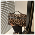 Detail of leopard print box bag with dual metal zippers and matching shoulder strap - Khaki