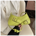 Detail of neon green pillow bag with cross-strap design and gold buckle finish - Green