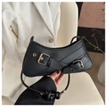 Detail of black faux leather baguette bag with gold buckles and chic knotted strap - Black