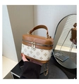 Detailed macro view of the two-tone patchwork box bag featuring a wraparound double zipper - White