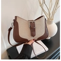 Close-up of retro contrast stitching bag with beige canvas and brown leather details - Brown