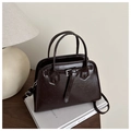 Detail of dark brown retro tote bag with glossy leather texture and belt buckle decor - Dark Brown