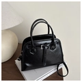 Detail of black faux leather tote bag with glossy texture and adjustable strap - Black