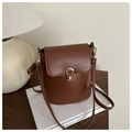 Brown bucket bag in textured faux leather with gold buckle and adjustable strap - Brown