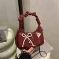 Dark red glossy crescent handbag with pearl bow and wrinkled handle for 2025 fashion - With Pendant / Red