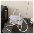 Detail of light blue crossbody bag featuring marbled texture and knotted handle - Small / Blue