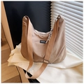 Detail of khaki nylon crescent bag with wide strap, black label, and checkered silk scarf - Khaki