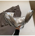 Detail of silver metallic crescent bag featuring vertical pleats and grommet strap - Silver