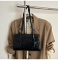 Close-up of a minimalist black rectangular shoulder bag with fine leather texture - Black Without Pendant