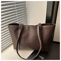 Detailed view of brown woven texture on a large capacity tote bag in natural light - Coffee