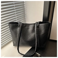 Detail showing the intricate hand-woven texture of the black large capacity tote bag - Black