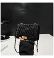 Detail of black quilted leather shoulder bag with gold twist lock and chain strap - Black