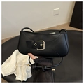 Close-up of black crescent moon bag with matte leather finish and gold square buckle - Black