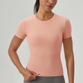 Eng anliegendes pfirsichfarbenes Yoga-T-Shirt mit Rundhalsausschnitt und Stretchstoff - S / Pfirsichflaum