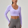 Paarse crop top met lange mouwen en duimgaten voor fitness en sportieve training - S / Zacht Paars