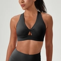 Black high-impact sports bra with front twist knot and cutout detail for fitness - S / Tops / Black
