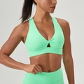 Women's mint green sports bra with v-neck twist design and matching yoga leggings - S / Tops / New Leaf Green
