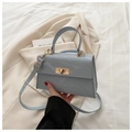 Gray-blue glossy leather crossbody bag with gold rotating clasp and top handle strap - Blue
