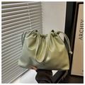 Detail of mint green wrinkled tote bag with drawstring closure and silver bow detail - Green