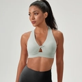 Pale green twist-front sports bra with deep V-neck and wide supportive band - Graphite Grey