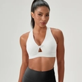 White high-impact sports bra featuring deep V-neck and twist knot design for yoga - White