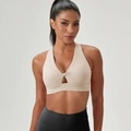 Beige front twist yoga bra with teardrop cutout and wide supportive elastic band - Beige