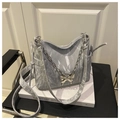 Detail of light blue pleated velvet shoulder bag with silver chain and butterfly charm - Silver